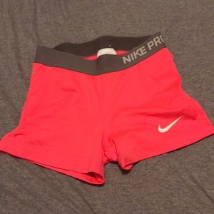 bright pink nike pro compression shorts